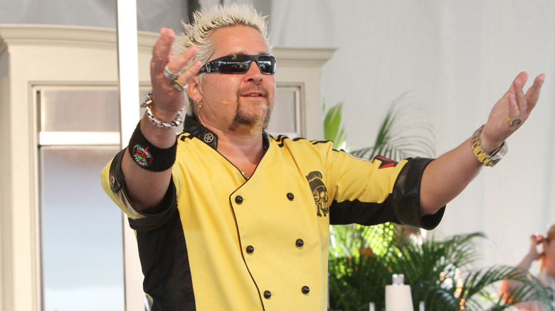 Guy Fieri with arms raised