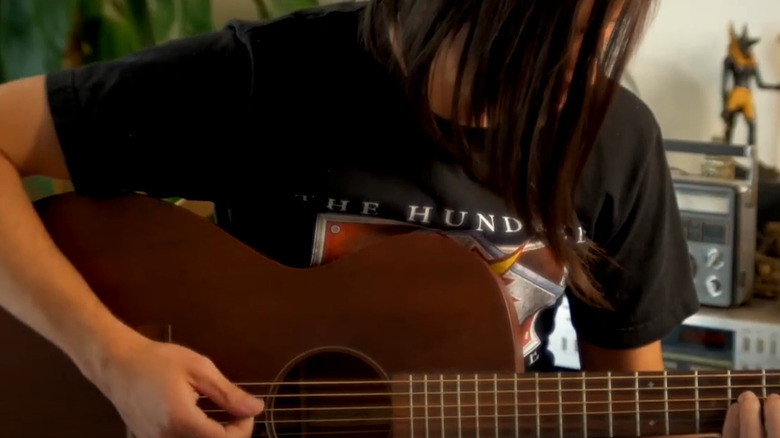 Matt Stonie playing guitar