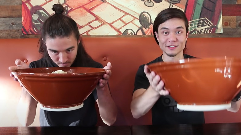 Matt and Morgan Stonie with giant bowls of ramen