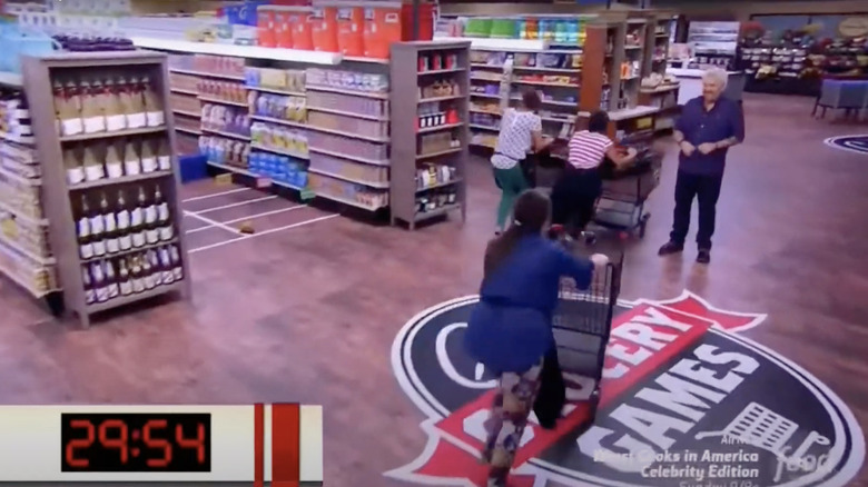 contestants running towards aisle six