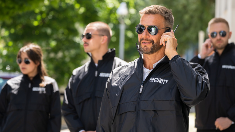 group of bodyguards standing outside