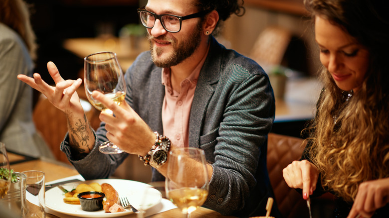 Diners eating, drinking, and chatting 