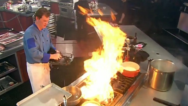 Iron Chef America contestant cooking