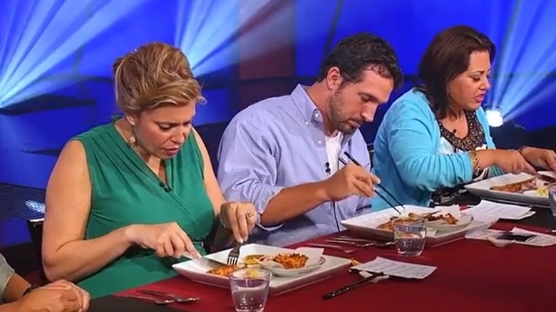 A panel of judges in Iron Chef America