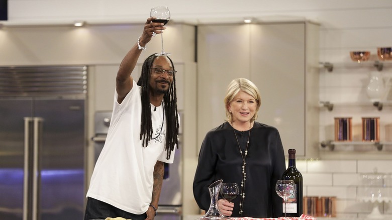 Snoop Dogg and Martha Stewart drinking red wine on set of Potluck Dinner Party