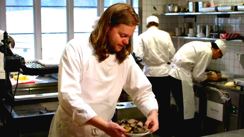 Magnus Nilsson cooking in a kitchen