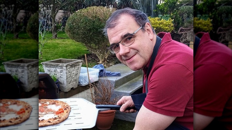 Jurgen making homemade pizza in the yard