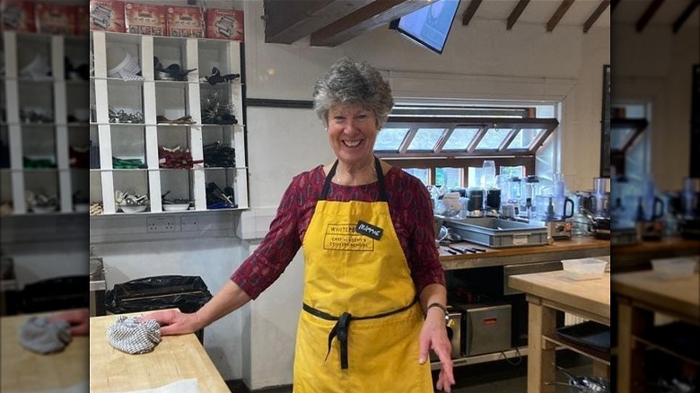 Maggie wearing apron in the kitchen  