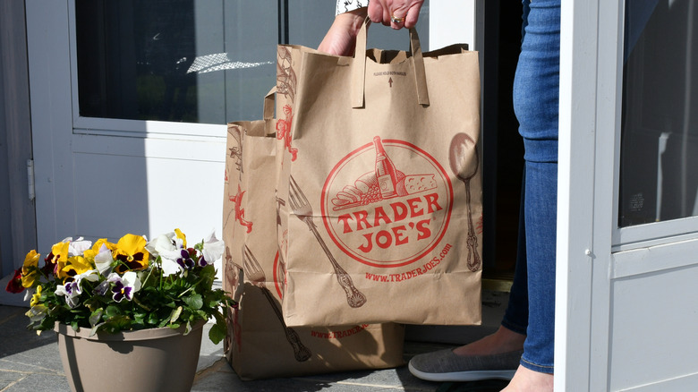 Putting down Trader Joe's bags