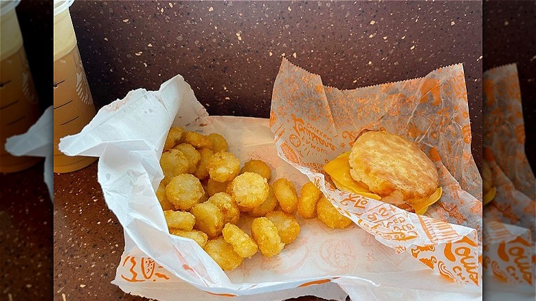 Breakfast sandwich and hash browns 