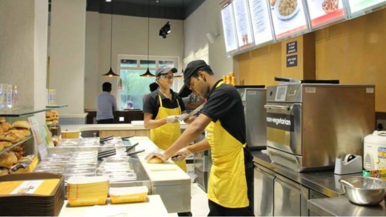 Au Bon Pain employees making sandwiches