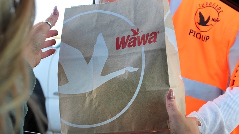 person getting Wawa curbside delivery 