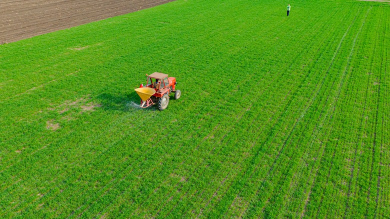 Tractor fertilizing farm