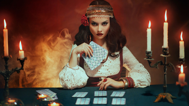 Fortune teller preparing card reading