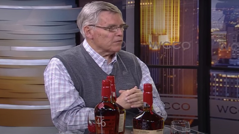 Bill Samuels Jr. with bottles of Maker's Mark