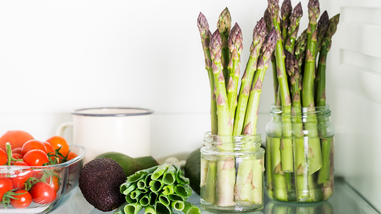 asparagus stored in jars with water