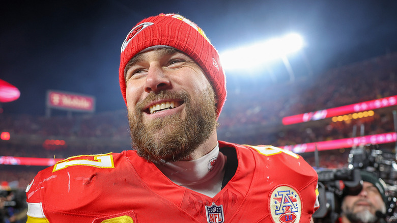 Travis Kelce smiling in knit cap