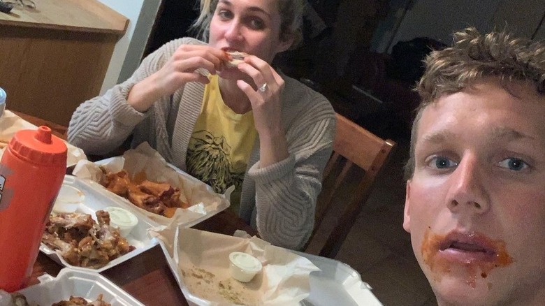 Caeleb Dressel eating wings