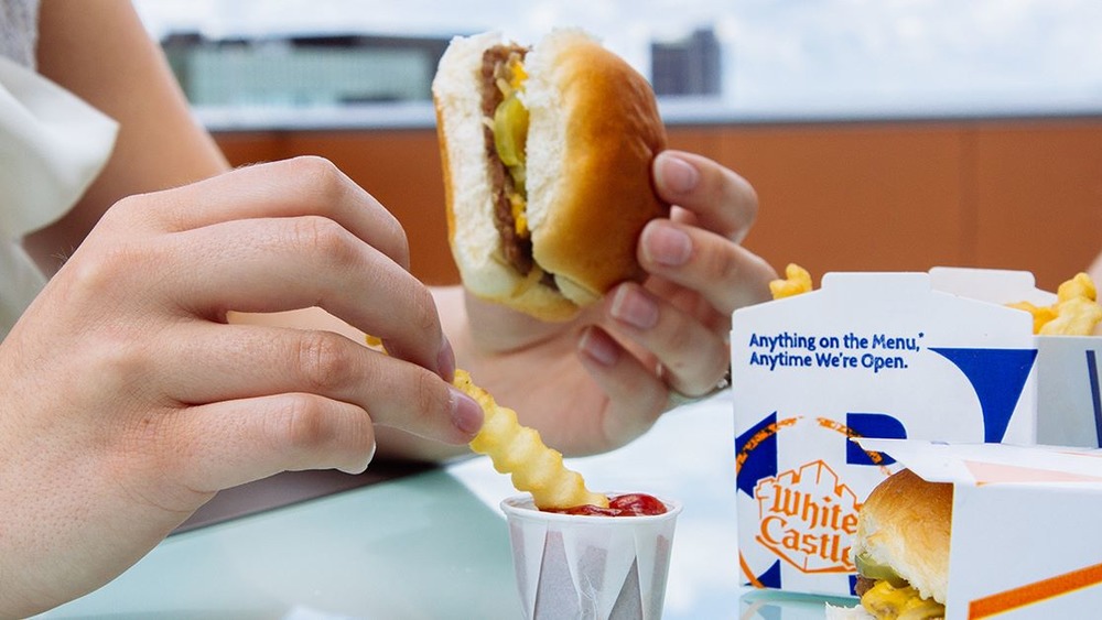 White Castle french fry dipped into ketchup