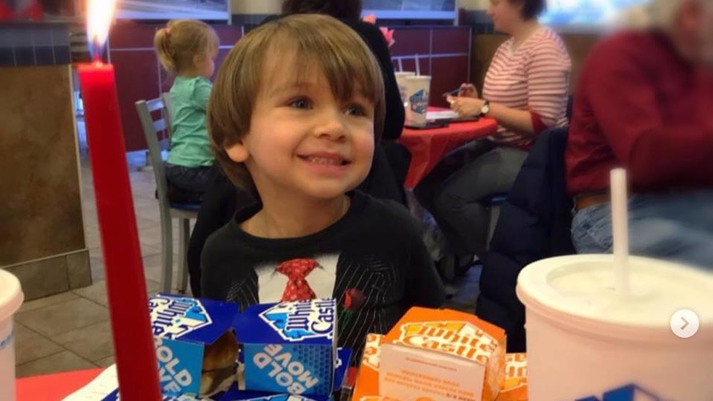 Child eating White Castle burgers