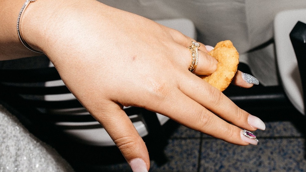 Person wearing White Castle chicken ring