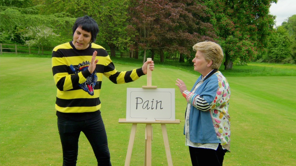 Noel Fielding and Sandi Toksvig outside