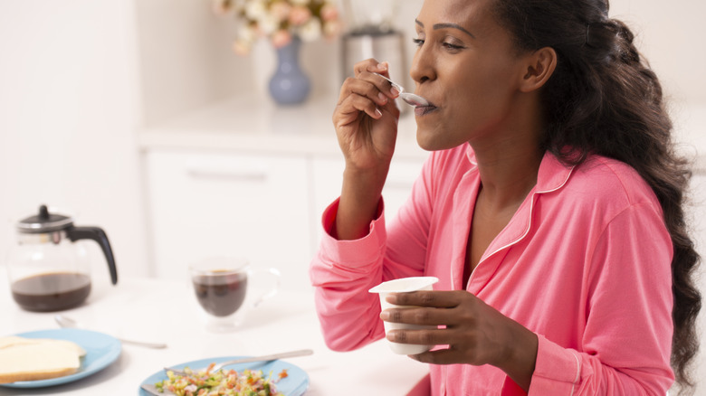 woman eating yogurt