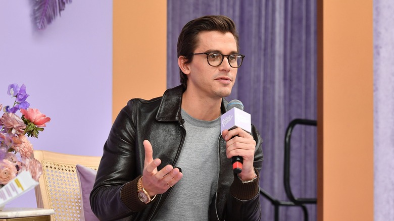 Antoni Porowski with a microphone