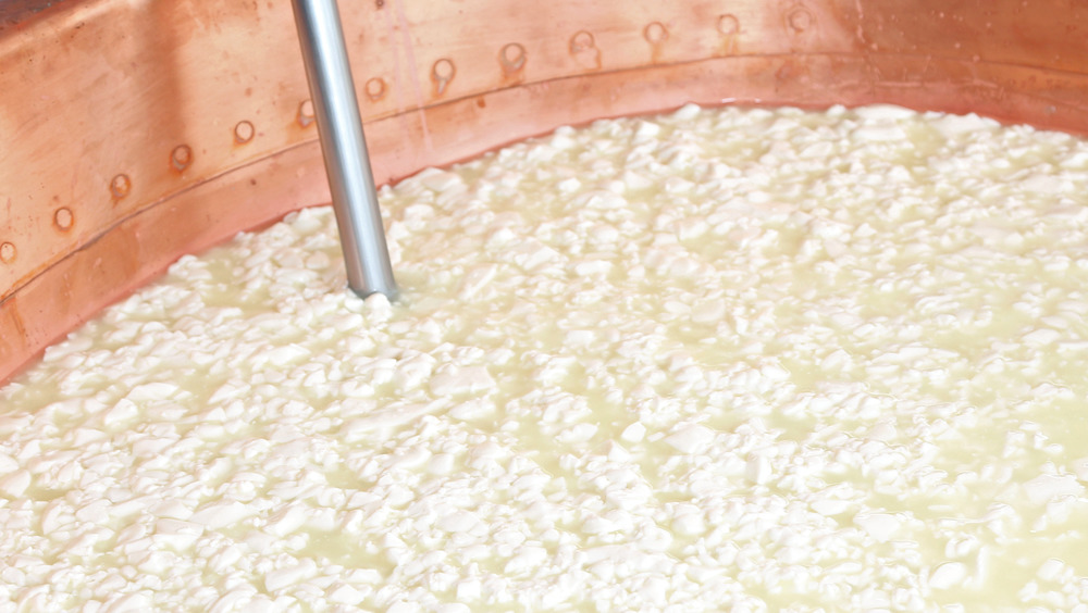 Curds and whey in a brass container
