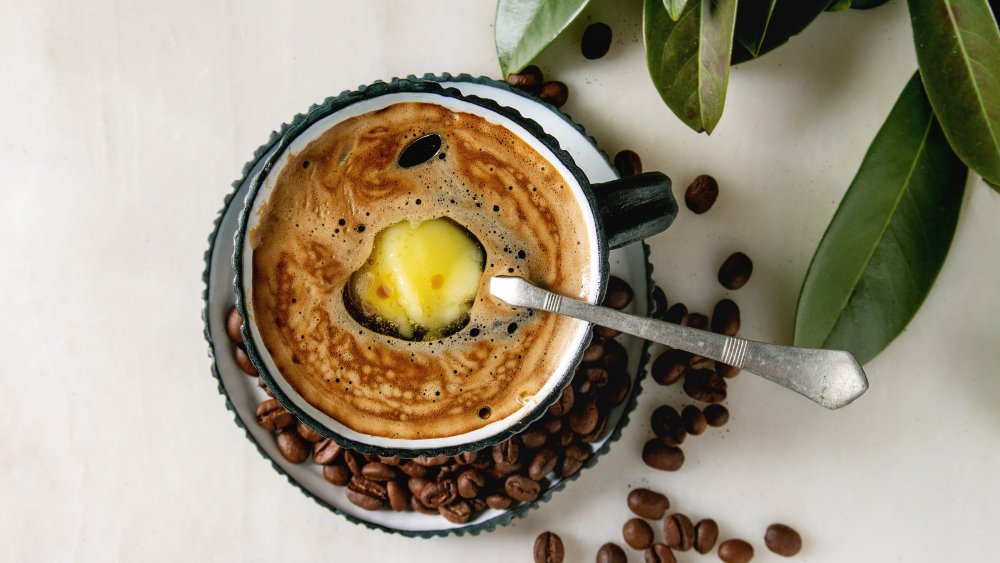 Butter melting in a cup of bulletproof coffee