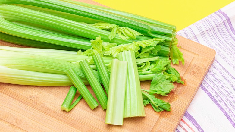 stalks of celery on cutting board