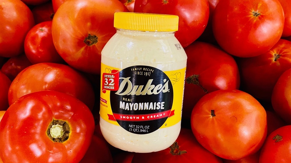 Duke's Mayonnaise over tomato background