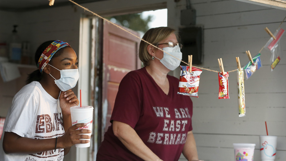 High school concession stand, candy and snacks hang from strings