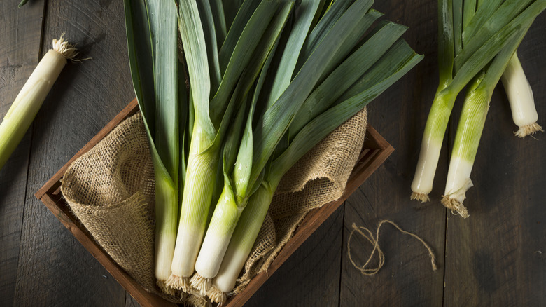 leeks in wooden basket