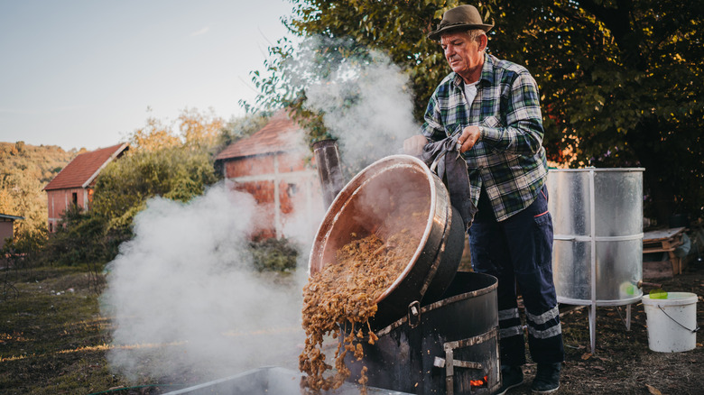 man making moonshine