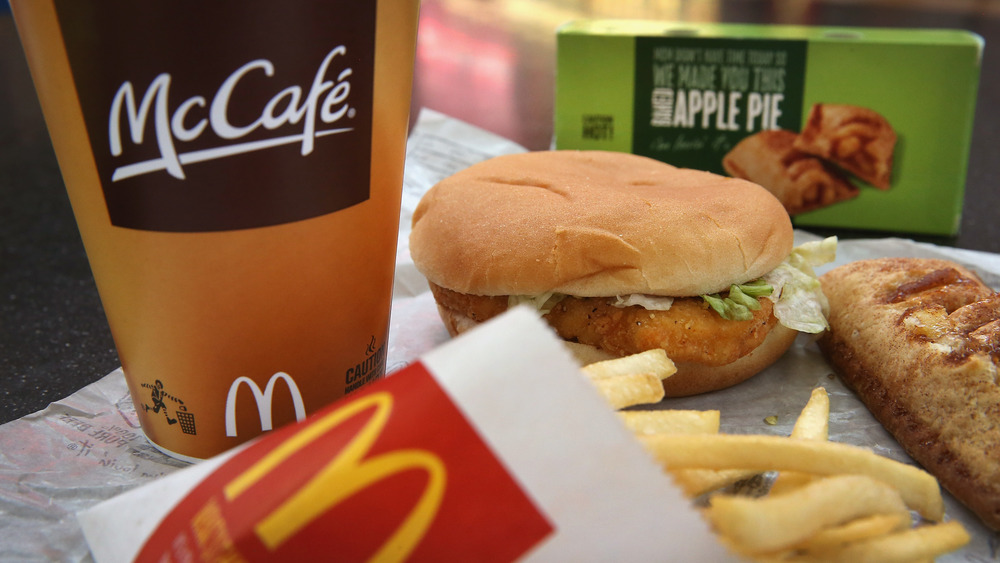 a close-up of a beverage container announcing the dollar menu