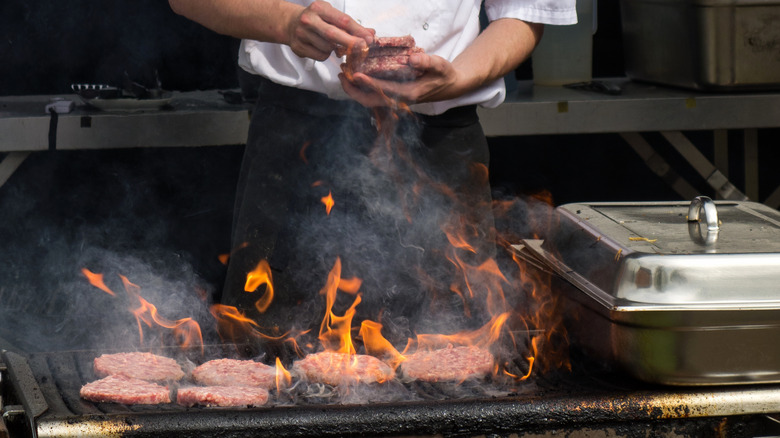 chef grilling burgers