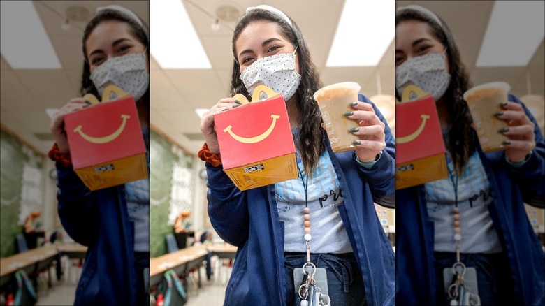 Teacher in mask with McDonald's Thank You Meal