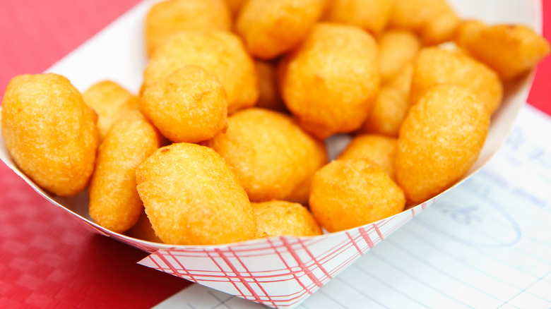 Battered cheese curds in takeout box