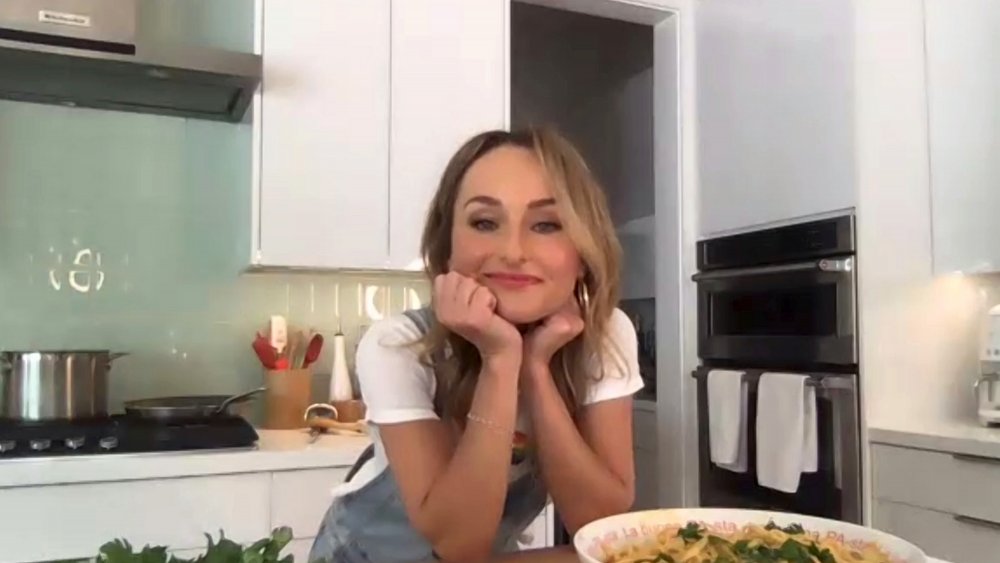 Giada De Laurentiis leaning on counter