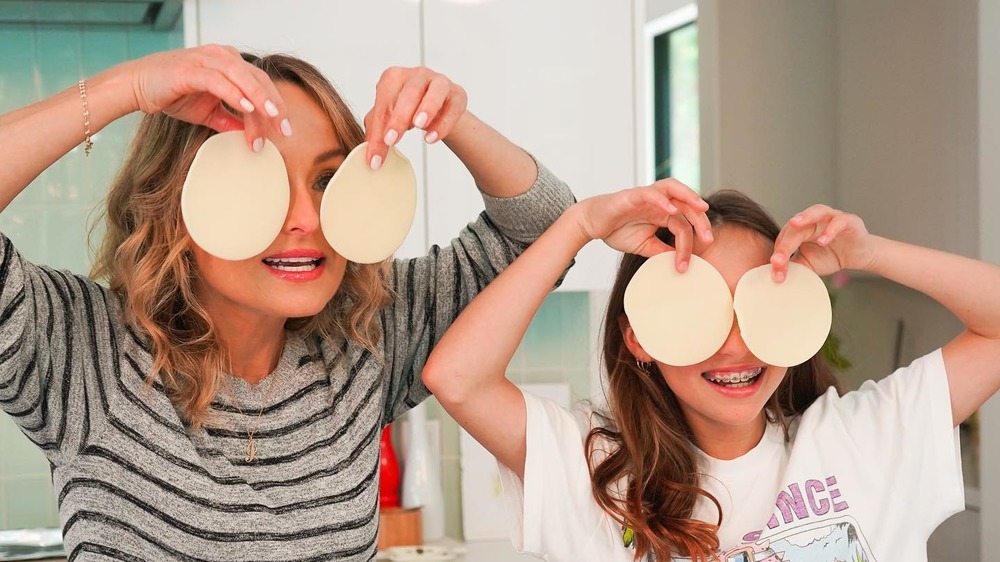 Giada De Laurentiis and Jade Thompson holding dough circles