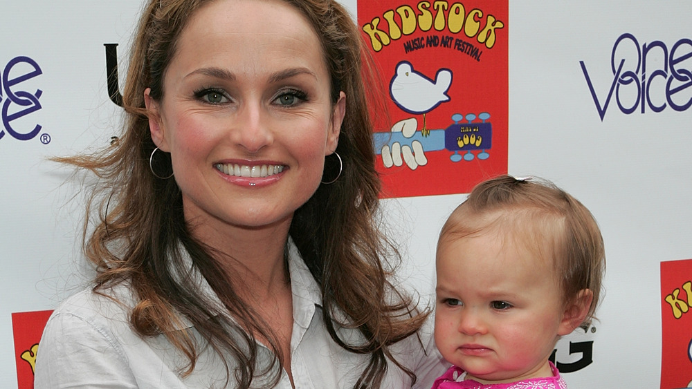 Giada De Laurentiis holding a toddler Jade Thompson