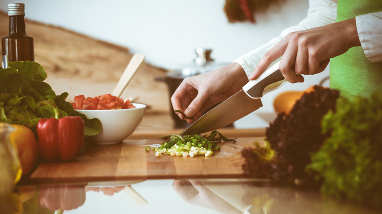 woman chopping ingredients