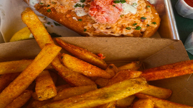 Close-up of the Lobster Grinder Roll and fries at Slapfish