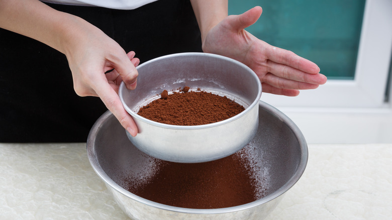 Sifting cocoa powder