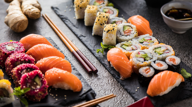 sushi rolls with chopsticks