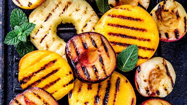 Grilled fruits on cooking surface