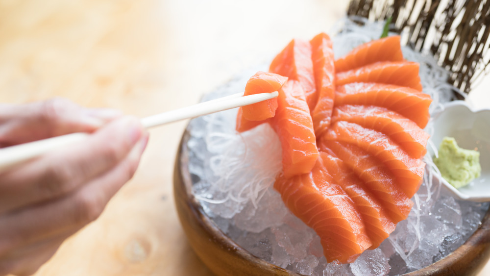 Salmon sashimi over ice with wasabi