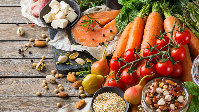 Food array including feta cheese, salmon, tomatoes, and carrots