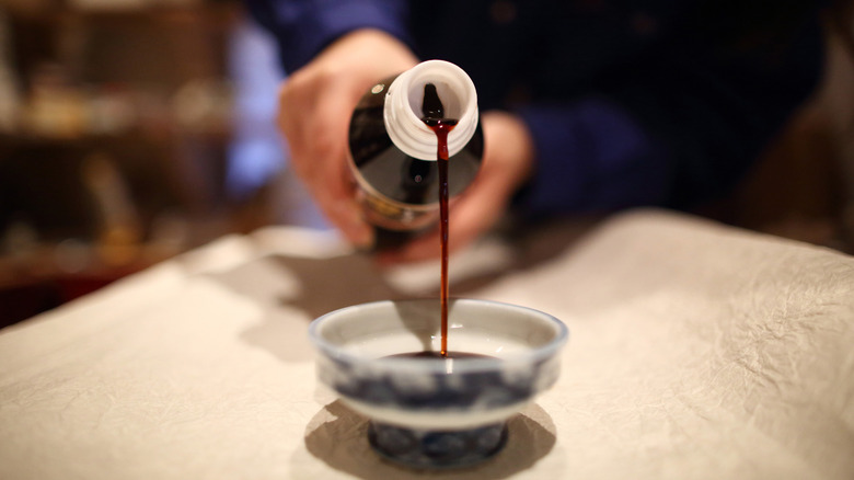 Pouring sauce into a bowl